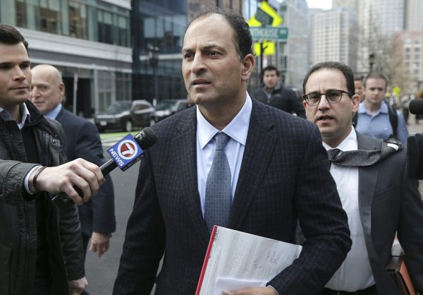 David Sidoo, of Vancouver, Canada, leaves following his federal court hearing