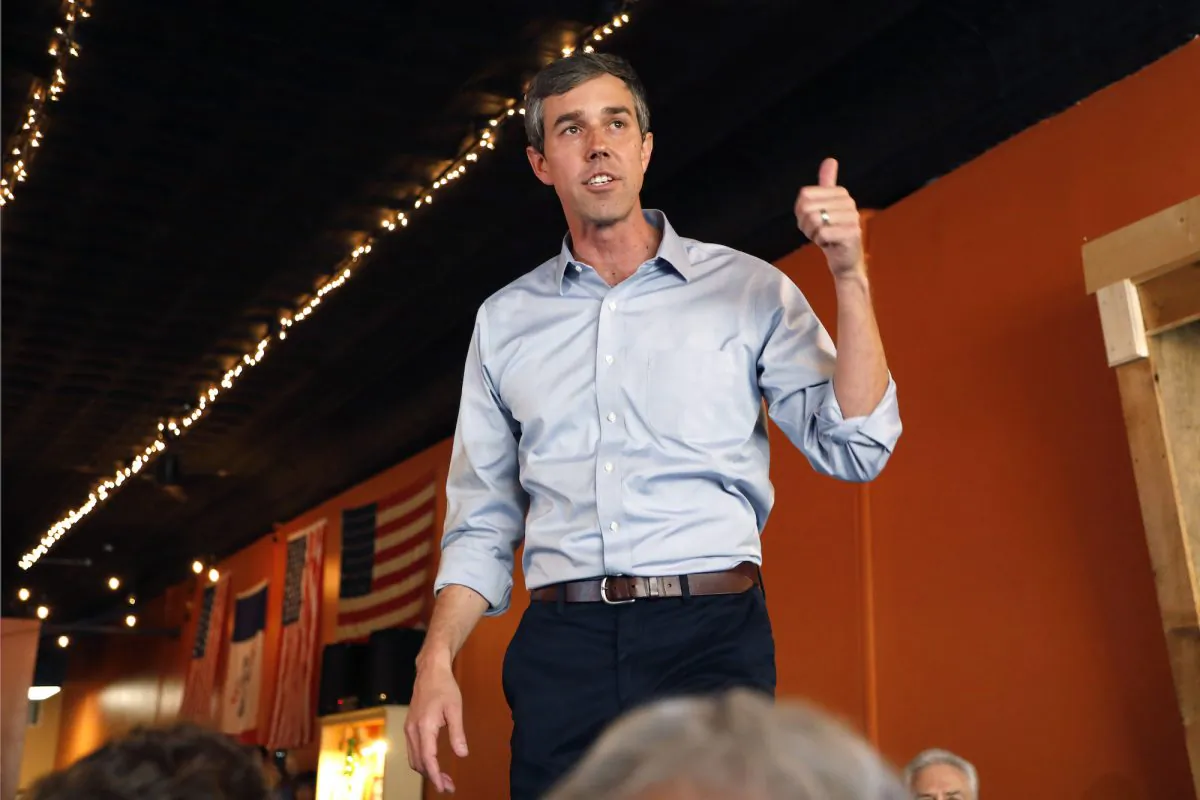 Former Texas congressman Beto O’Rourke speaks to local residents during a stop at the Central Park Coffee Company in Mount Pleasant, Iowa, on March 15, 2019. (Charlie Neibergall/AP Photo)