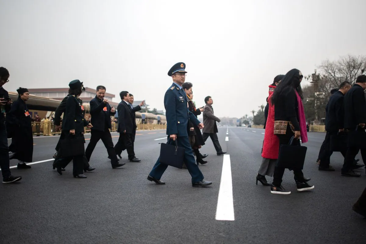 Delegates arrive at the second Plenary Meeting of the second session of the Chinese People's Political Consultative Conference in Beijing's Great Hall of the People March 9. (Fred Dufour/AFP/Getty Images)