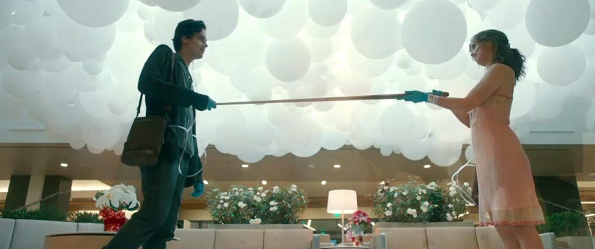 boy and girl with pool cue