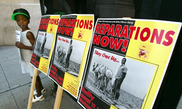 A slavery reparations protest outside New York Life Insurance Company offices in New York City on Aug. 9, 2002. (Mario Tama/Getty Images)