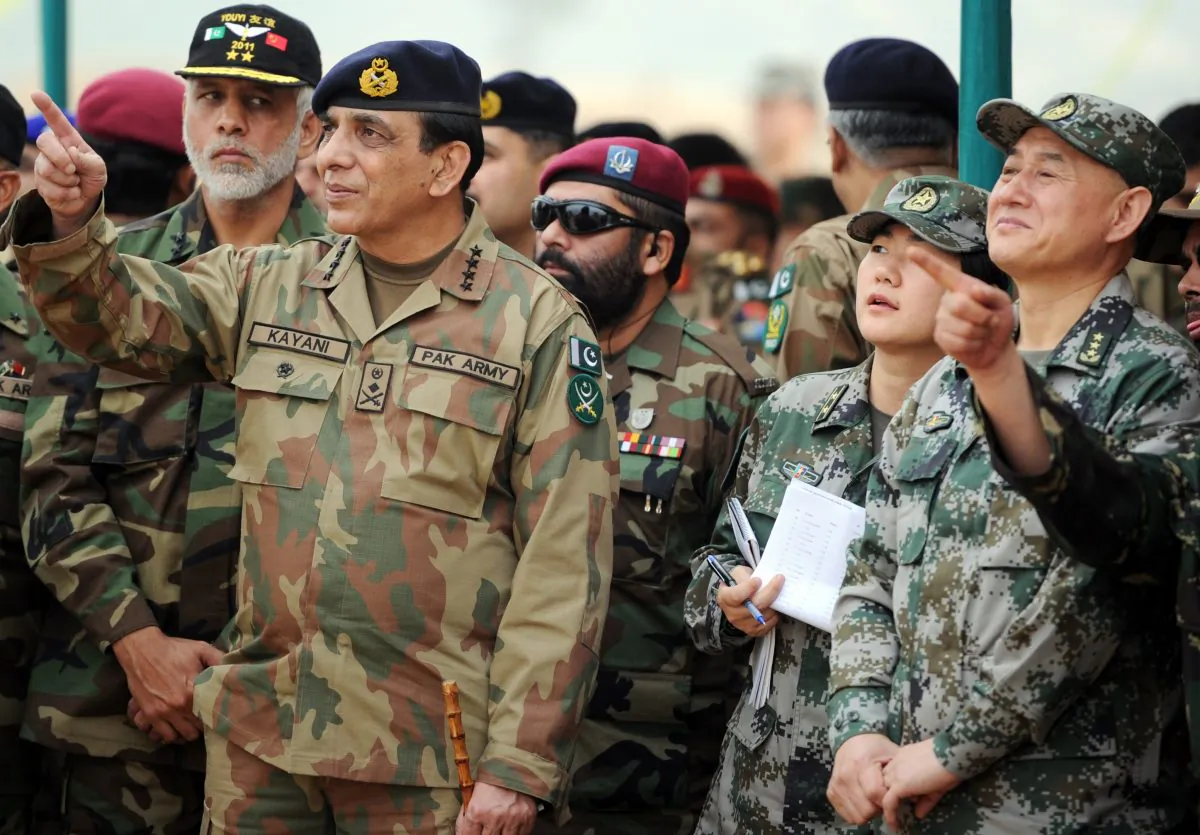 Pakistan's army chief General Ashfaq Kayani (L) and General Hou Shusen (R), Deputy Chief of Staff of Chinese People's Liberation Army (PLA), watch the Pakistan-China military drill in Jhelum, Pakistan, on November 24, 2011. (Aamir QureshiAFP/Getty Images)