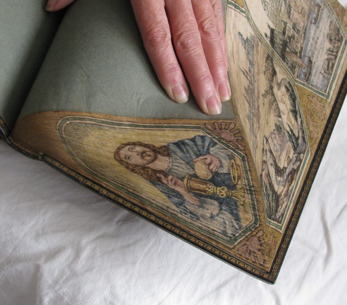 Jesus painting on book