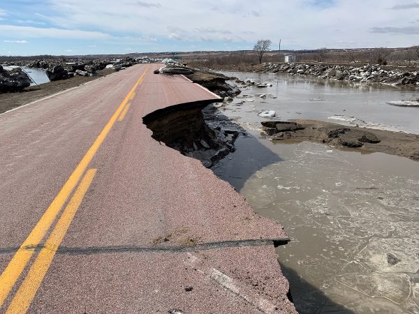 A damaged road is seen after a storm triggered historic flooding in Niobrara