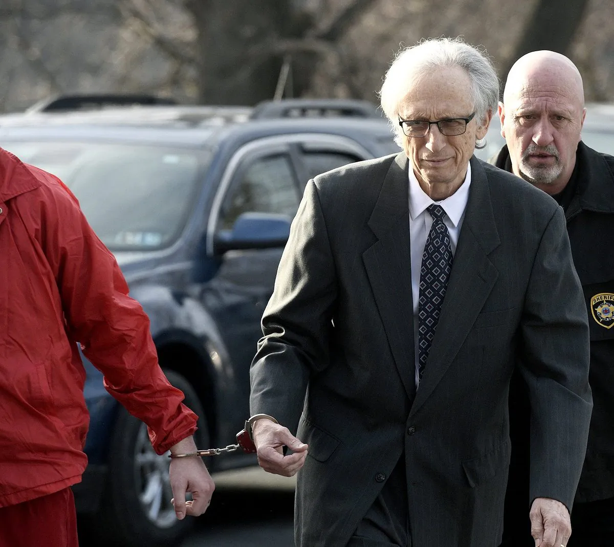 Dr. Johnnie Barto heads into Cambria County Courthouse, in Ebensburg, Pa.,for his sentencing in the sexual assault of over two dozen children,on March 18, 2019. (Todd Berkey/The Tribune-Democrat via AP)