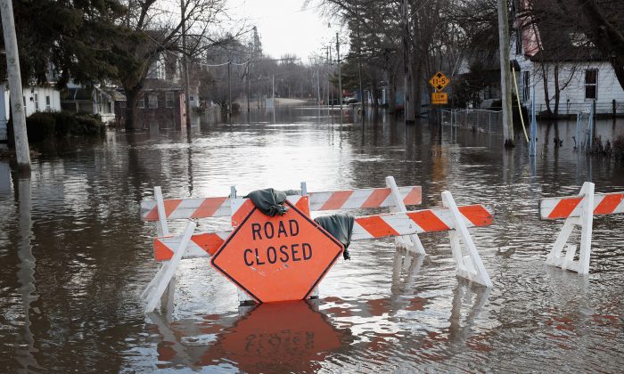 A road is covered with floodwater from the Pecatonica River on March 18, 2019 in Freeport, Illinois.(Scott Oslon/Getty Images)