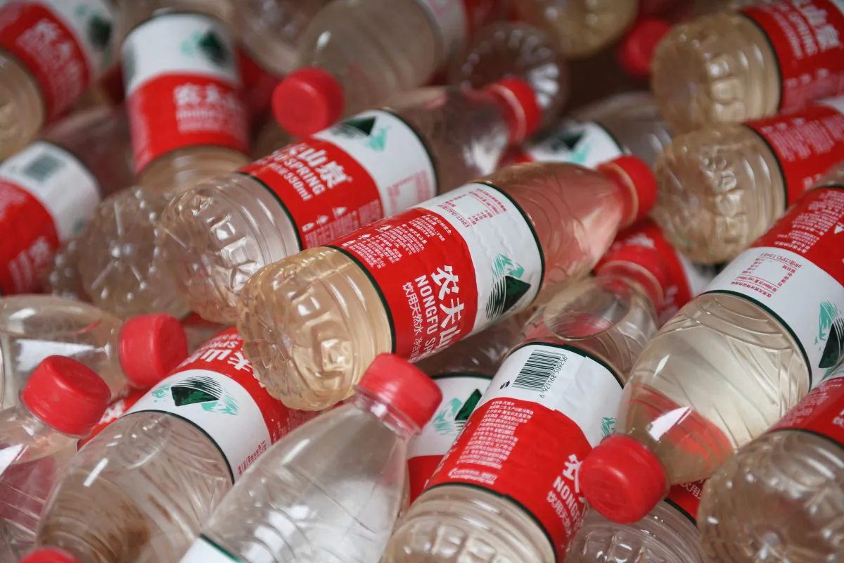 The polluted water in mineral water bottles in Beijing on July 12, 2018. (GREG BAKER/AFP/Getty Images)