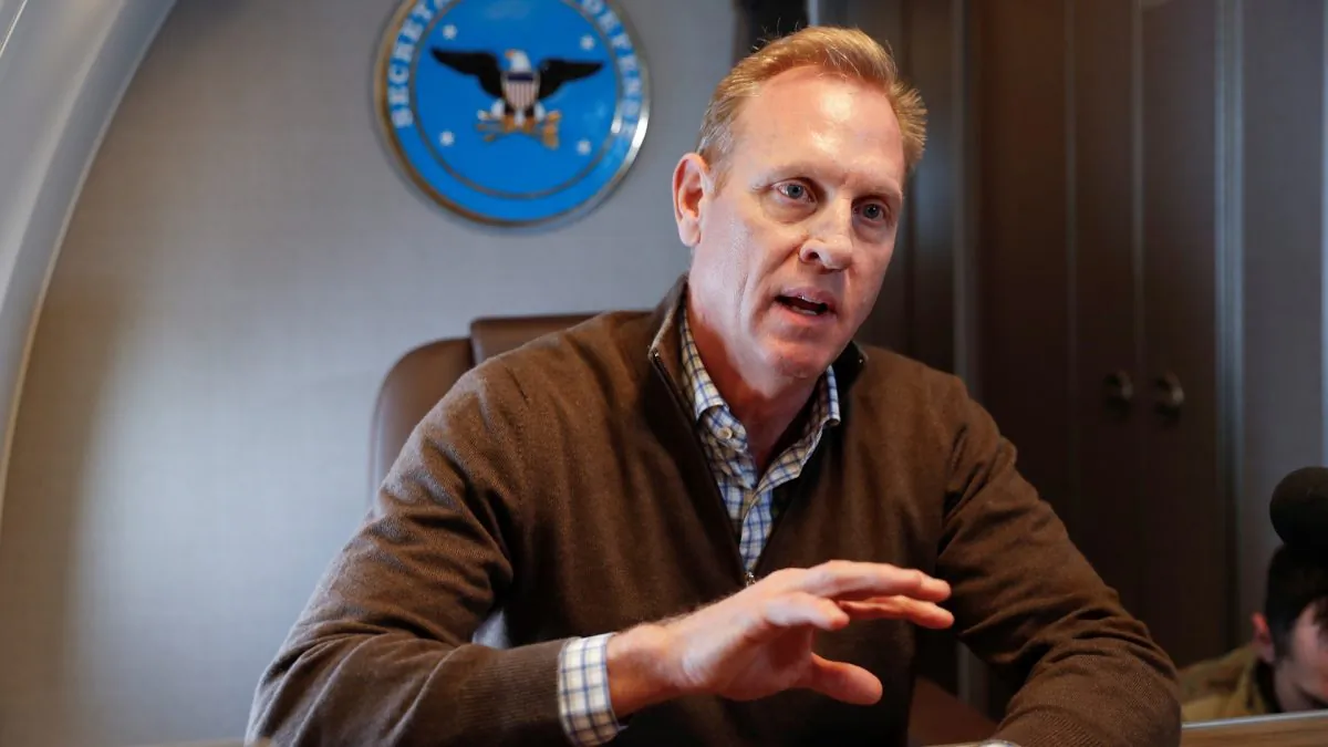 Acting Secretary of Defense Patrick Shanahan gestures while speaking to members of the media aboard a military plane prior to his arrival at Andrews Air Force Base, Md. on Feb. 23, 2019. (Pablo Martinez Monsivais/Reuters)