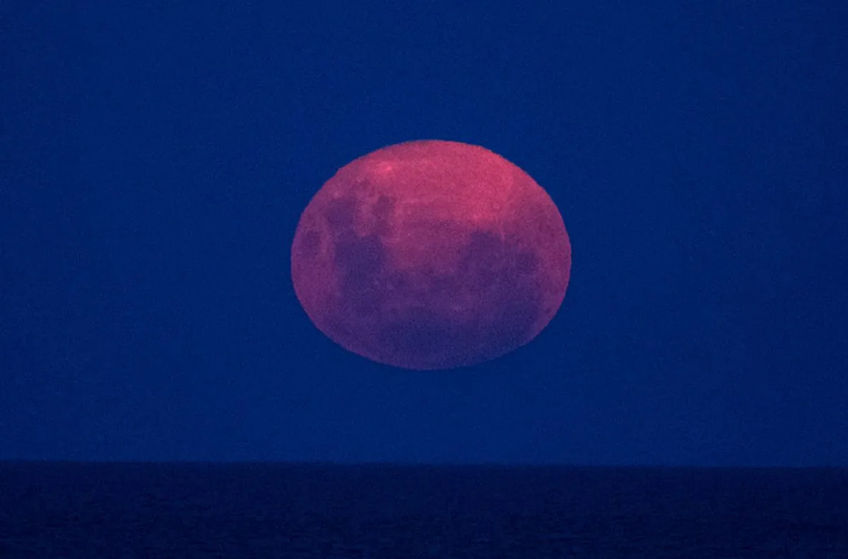 The "Supermoon" rises over the Rio de la Plata as seen from Buenos Aires on Feb. 19, 2019. (Alejandro Pagni/AFP/Getty Images)
