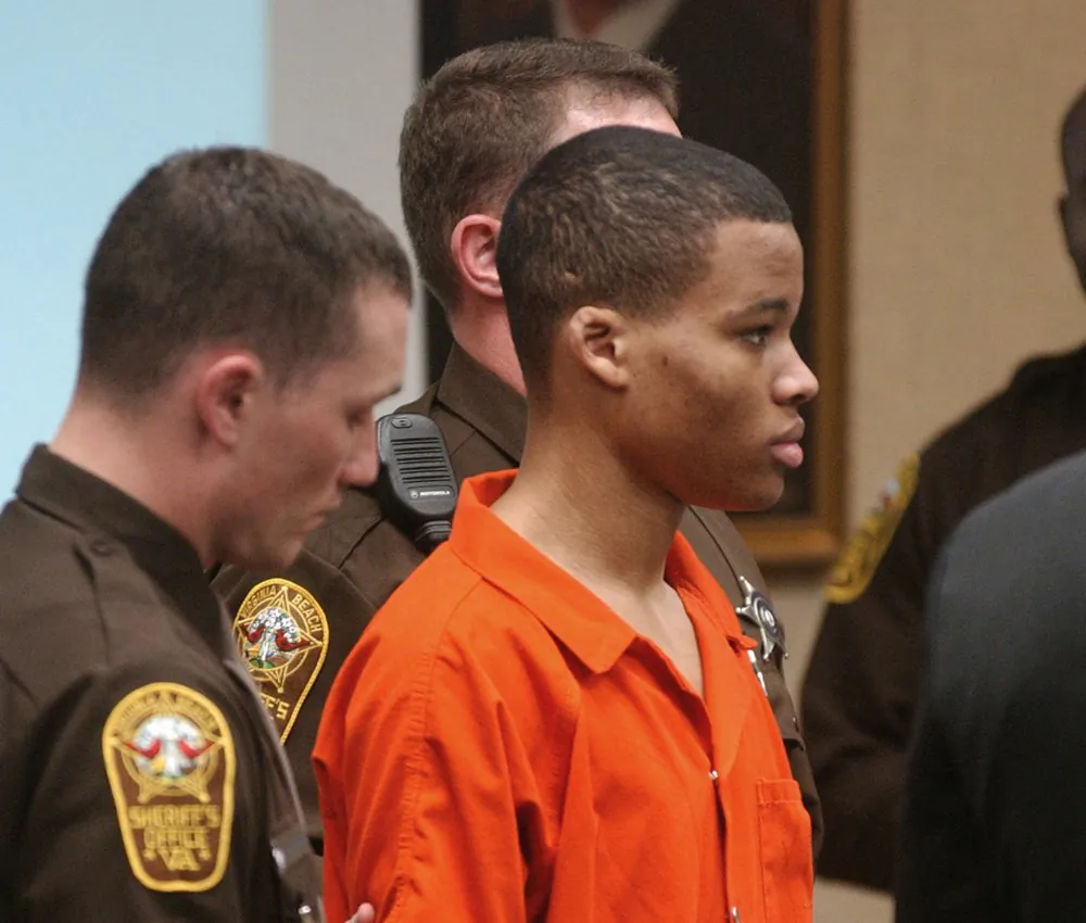 Lee Boyd Malvo listens to court proceedings during the trial of fellow sniper suspect John Allen Muhammad in Virginia Beach, Va., on Oct. 20, 2003. (Martin Smith-Rodden/AP Photo)