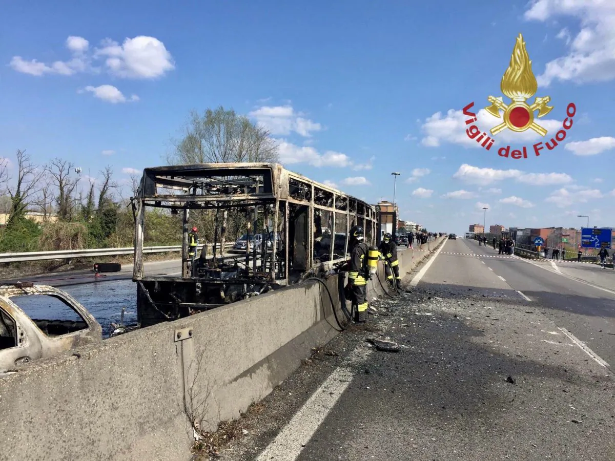 The wreckage of a bus that was set ablaze by its driver in protest against the treatment of migrants trying to cross the Mediterranean Sea, is seen on a road in Milan, Italy, March 20, 2019. (Vigili del Fuoco/Handout via Reuters)