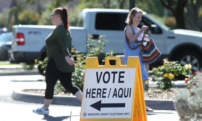 Arizona voters make their way to a polling place to cast their ballot during the midterm elections, Phoenix, Arizona, on Nov. 6, 2018. (Ralph Freso/Getty Images)
