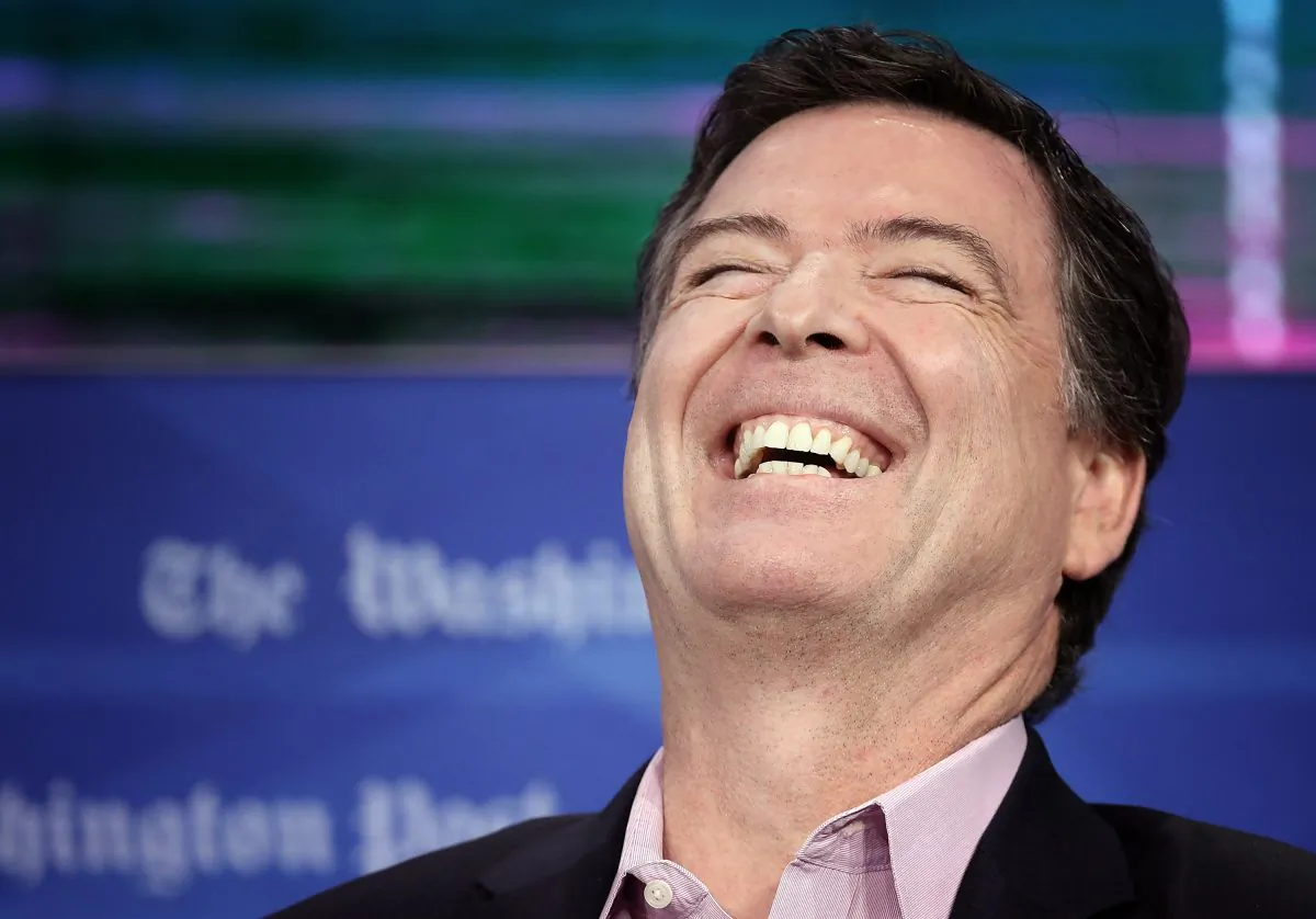 Former FBI director James Comey laughs while answering questions during an interview forum at the Washington Post on May 8, 2018. (Win McNamee/Getty Images)