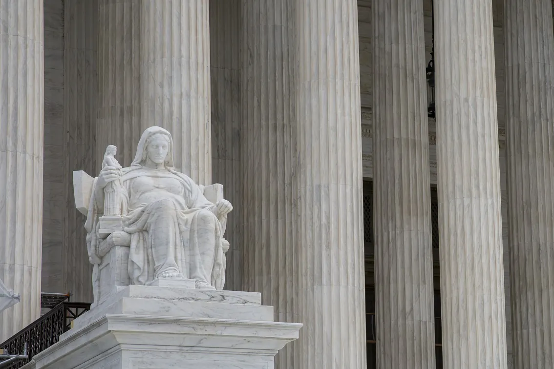 A statue outside the Supreme Court of the United States that stands for the contemplation of justice in Washington on Sept. 22, 2017. (Samira Bouaou/The Epoch Times)