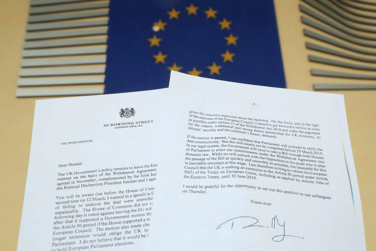 A copy of the letter sent by British Prime Minister Theresa May to European Council President Donald Tusk is seen next to a European Flag on March 20, 2019. (Yves Herman/Illustration/Reuters)