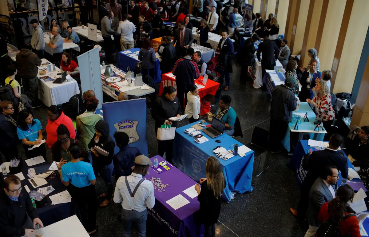 Job seekers speak with potential employers at a City of Boston Neighborhood Career Fair on May Day in Boston, Mass., on May 1, 2017. (Reuters/Brian Snyder)