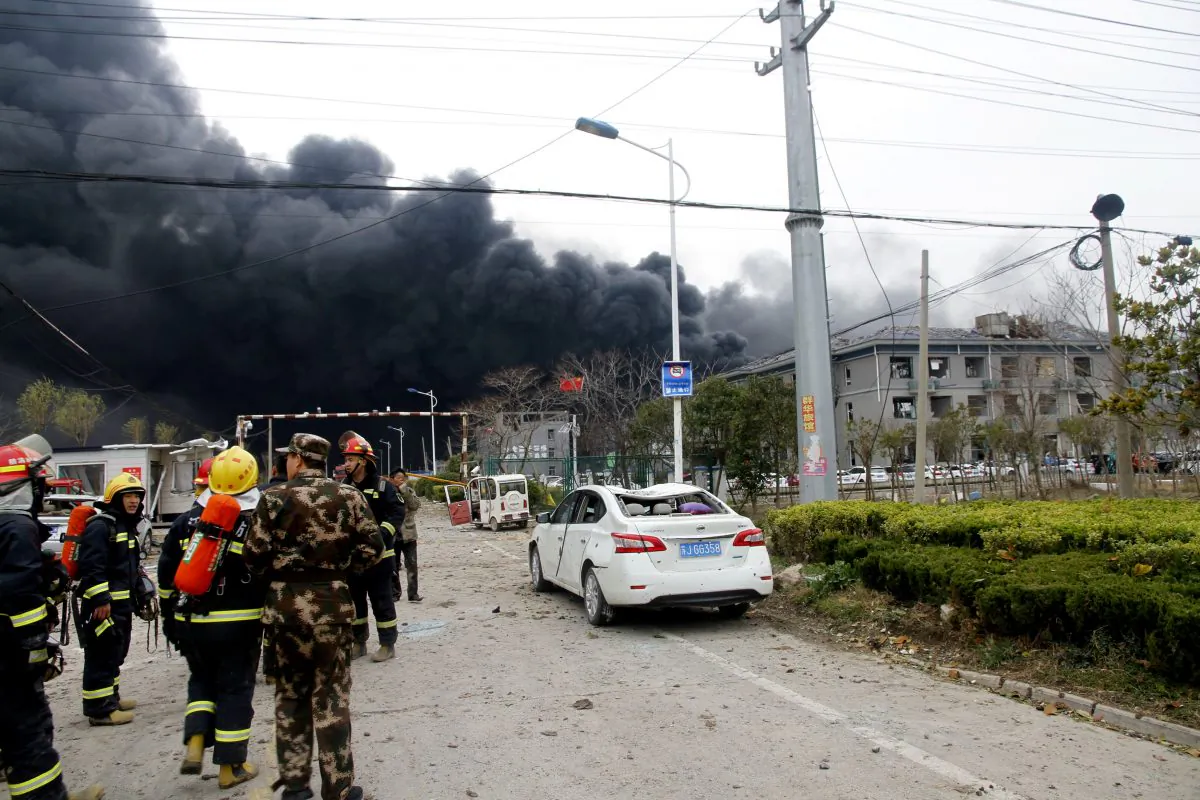 Rescue workers are seen near smoke following an explosion at a chemical industrial park in Yancheng City, China on March 21, 2019. (Reuters)