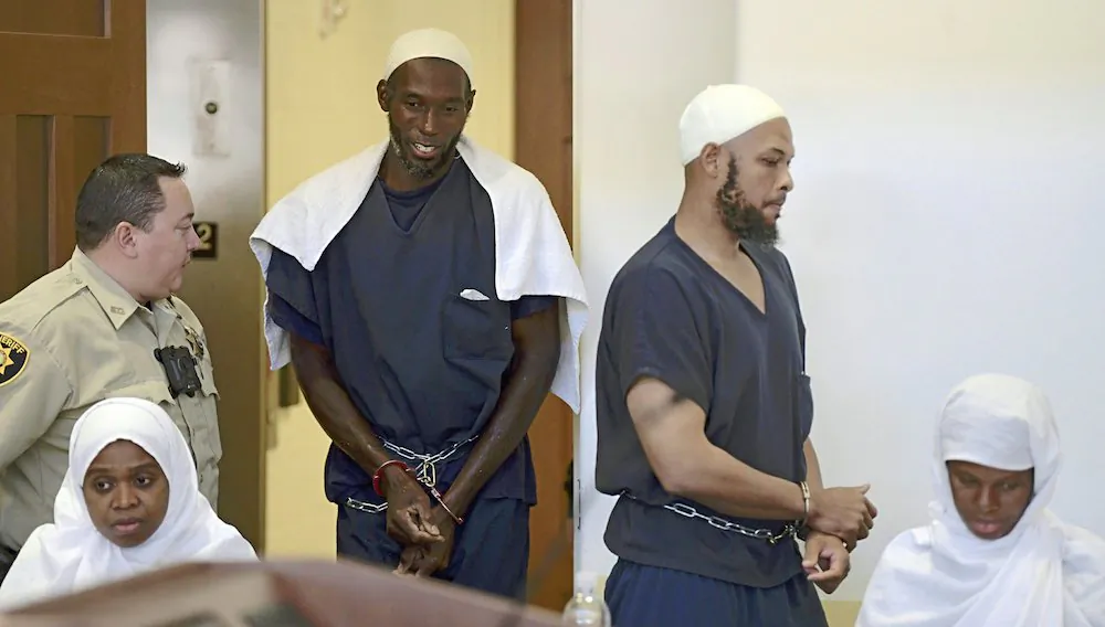 Defendants, from (L), Jany Leveille, Lucas Morton, Siraj Ibn Wahhaj and Subbannah Wahhaj entering district court in Taos, N.M. On Aug. 13, 2018. (Roberto E. Rosales/The Albuquerque Journal via AP)
