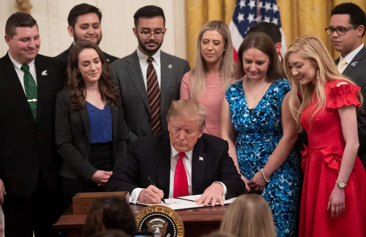 President Donald Trump signs an executive order to protect free speech on college campuses during a ceremony in the East Room of the White House in Washington, on March 21, 2019. (Saul Loeb/AFP/Getty Images)