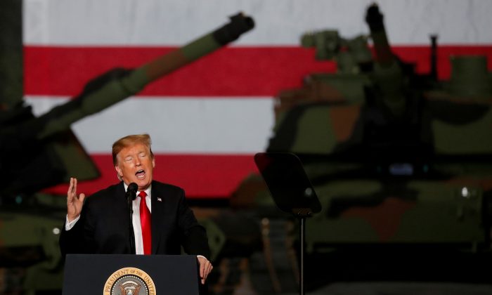 U.S. President Donald Trump speaks to workers in front of U.S. Army tanks on display at the Lima Army Tank Plant (LATP) Joint Systems Manufacturing Center, the country's only remaining tank manufacturing plant, in Lima, Ohio, U.S. on March 20, 2019. (Carlos Barria/Reuters)