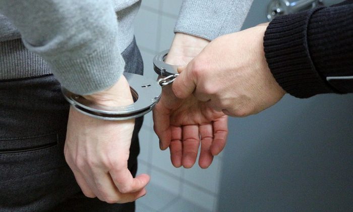Representational photo of handcuffs being applied to a suspect. (Pixabay)