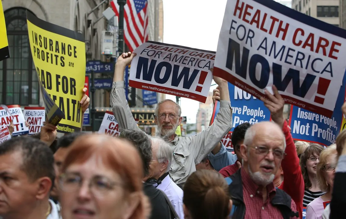 Health care reform supporters protest at a "Big Insurance: Sick of It" rally in New York City on Sept. 22, 2009. (Mario Tama/Getty Images)