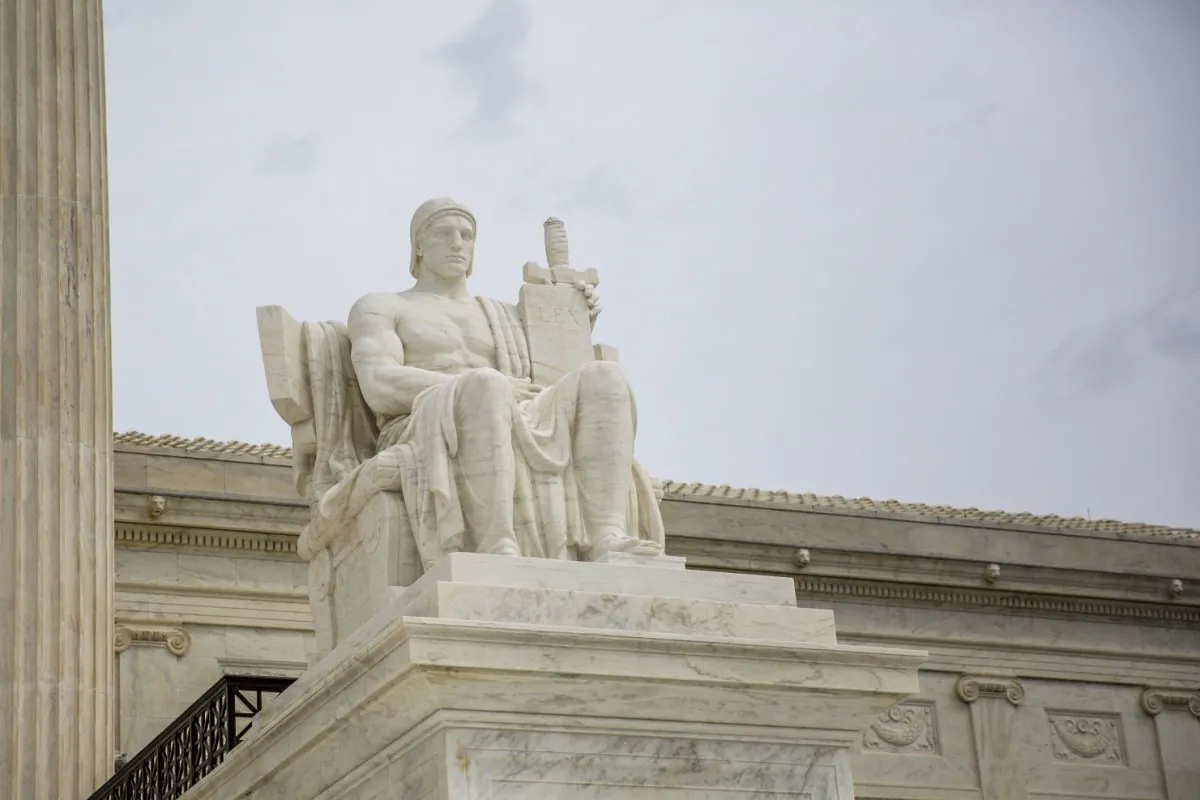A statue symbolizing the authority of justice outside the Supreme Court building in Washington on Sept. 22, 2017. (Samira Bouaou/The Epoch Times)