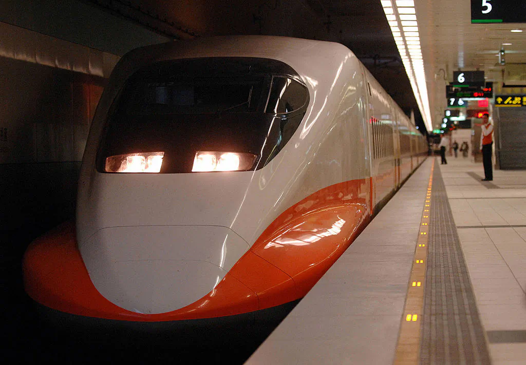 A security staff stands next to a Taiwan High-Speed train at Taoyuan station, on Nov. 30, 2006. (Sam Yeh/AFP/Getty Images)