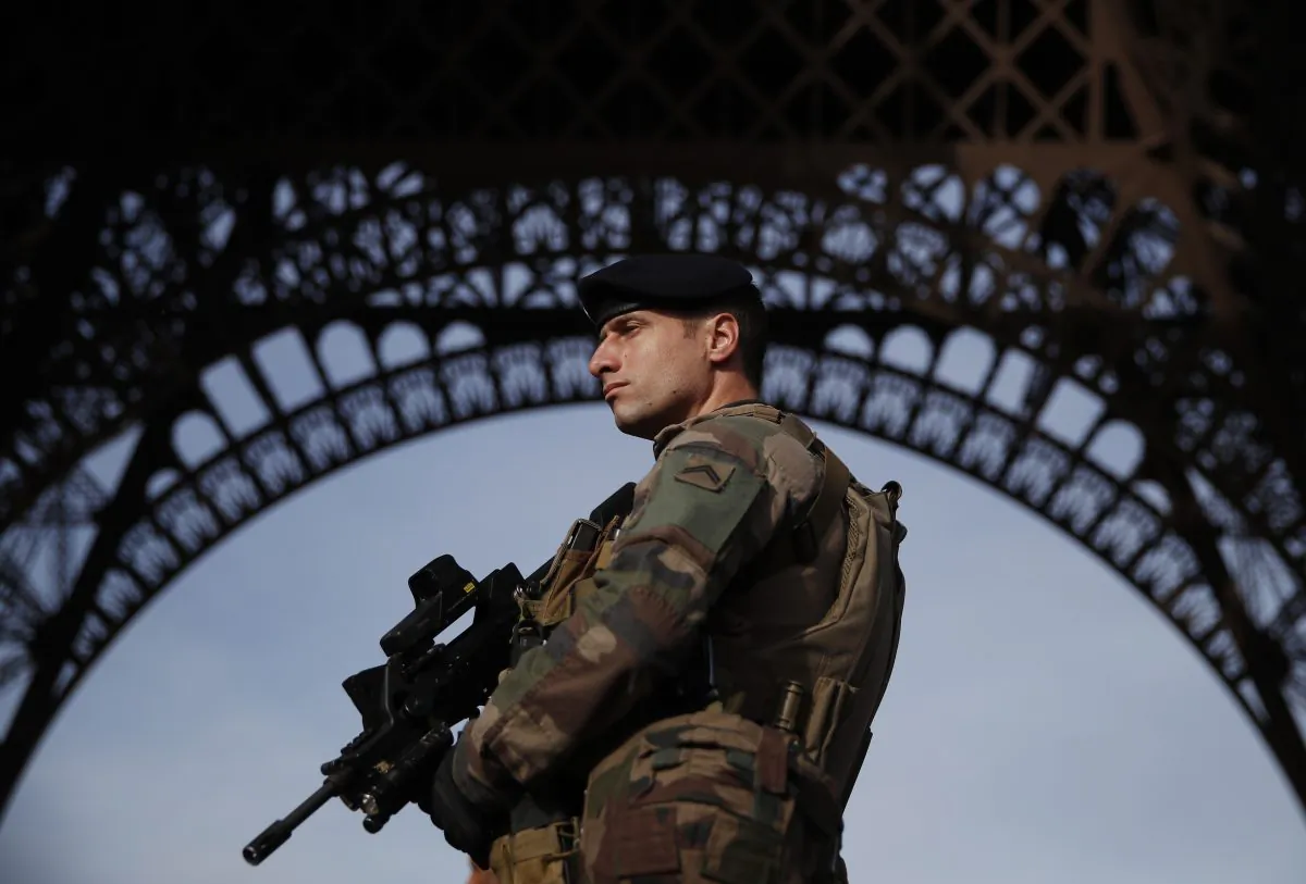 A Sentinelle soldier patrols in front of the Eiffel Tower, Paris, France on Nov. 1, 2017. (Christian Hartmann/AFP/Getty Images)