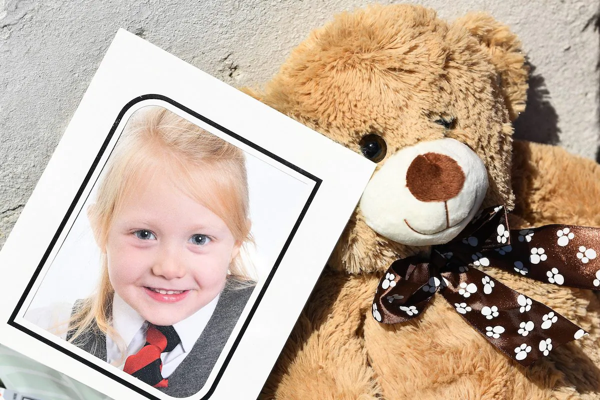 A school picture of Alesha MacPhail is left at a house on Ardbeg road on July 4, 2018. (Jeff J Mitchell/Getty Images)