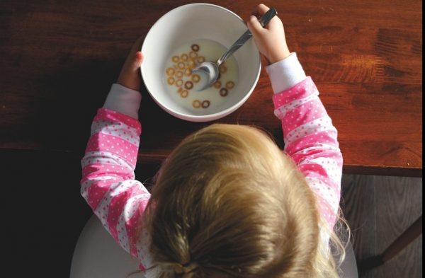Child eating Cheerios