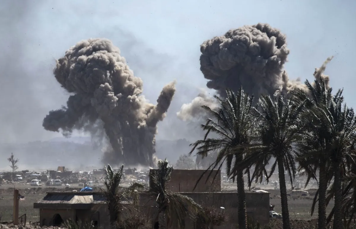 Heavy smoke rises above the ISIS' last remaining position in the village of Baghouz, Syria, on March 18, 2019. (Delil Souleiman/AFP/Getty Images)