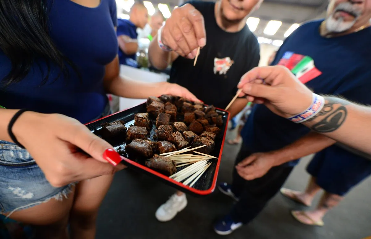 Care-carrying medical marijuana patients sample the brownies at Los Angeles' first-ever cannabis farmer's market at the West Coast Collective medical marijuana dispensary, on the fourth of July, or Independence Day, in Los Angeles, Calif. on July 4, 2014. (Frederic J. Brown/AFP/Getty Images)