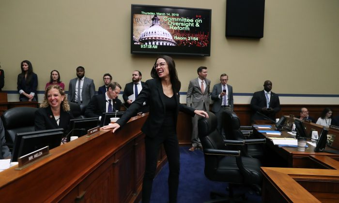 Rep. Alexandria Ocasio-Cortez (D-NY), talks with fellow members during a House Oversight and Reform Committee hearing in Washington on March 14, 2019. (Mark Wilson/Getty Images)