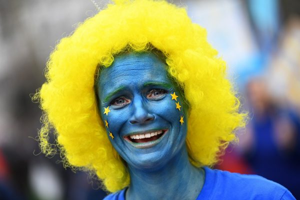 An EU supporter with her face painted, calling on the government to give Britons a vote