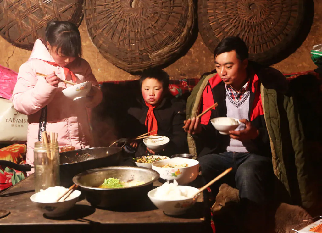 Wang Fuman, also known as "Frost Boy", with his family in Ludian in China's southwestern Yunnan province on Jan. 11, 2018. (AFP/Getty Images)