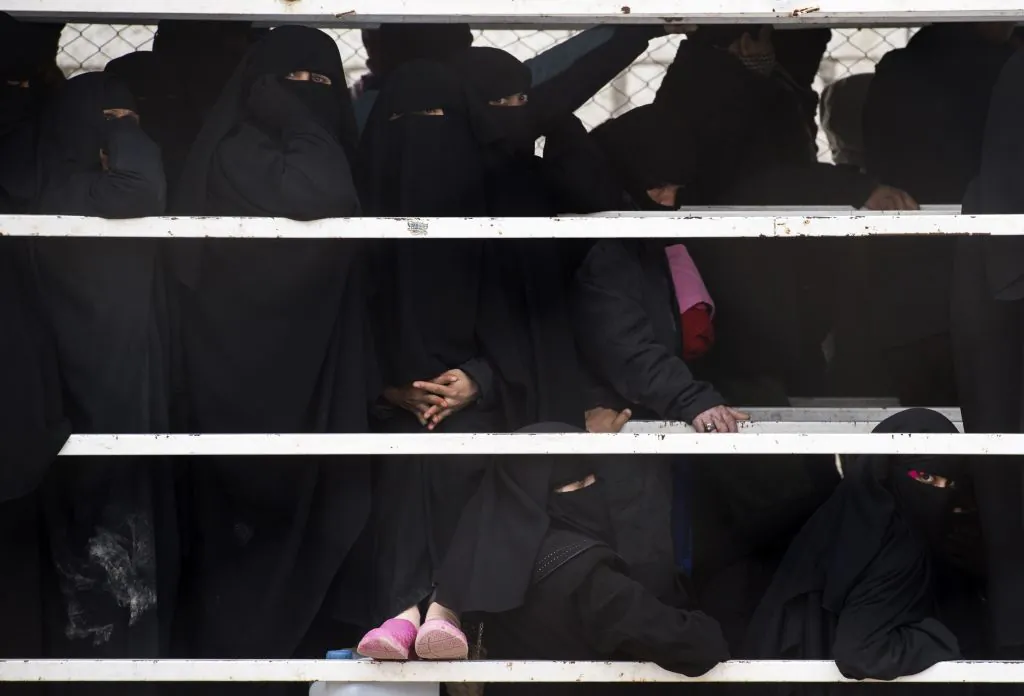 Displaced Syrians stand in line at the internally displaced persons (IDP) camp of al-Hol in northeastern Syria, on Feb. 7, 2019. (Fadel Senna/AFP/Getty Images)