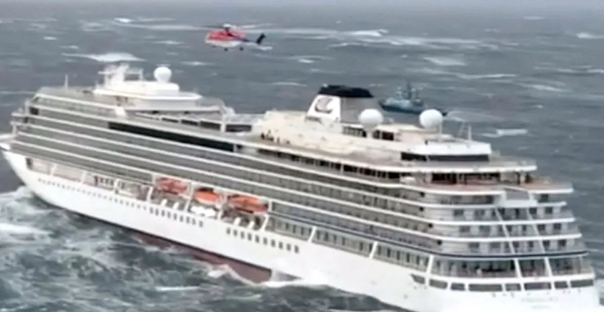 Viking Sky cruise ship with helicopter hovering above it in Hustadvika, Norway, on March 23, 2019. (CHC Helicopters via Reuters)