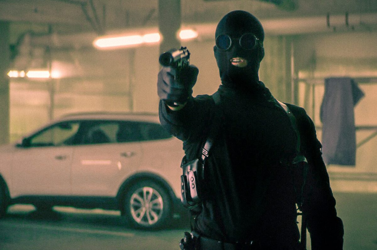 man in mask with gun