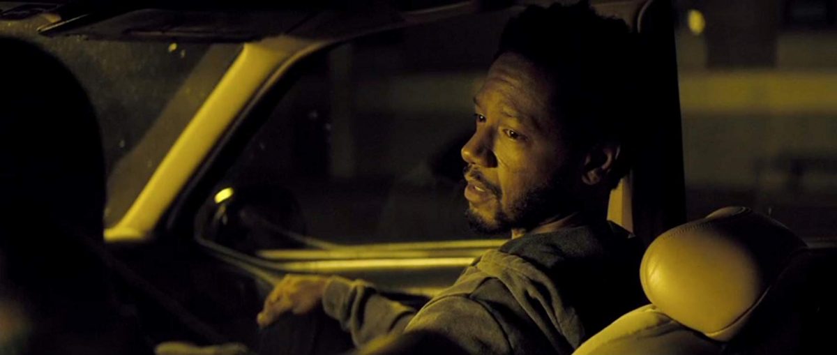 black man in car