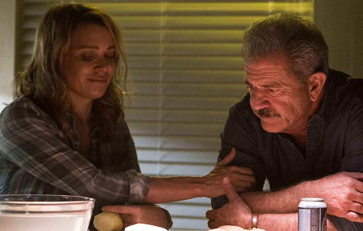 man and wife at dinner table