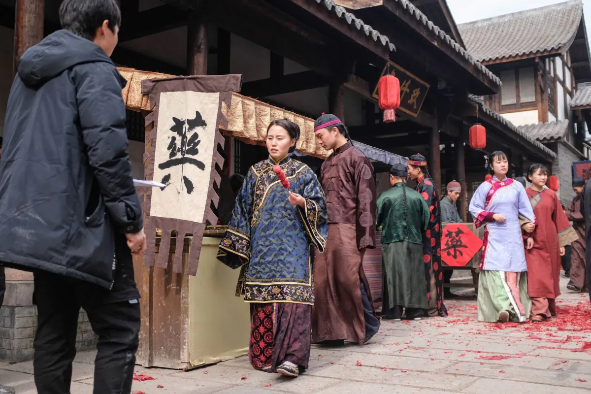 This photo taken on January 30, 2019 shows extras dressed in period costume walking on set during filming for a Chinese TV drama at Hengdian World Studios in Dongyang in China's eastern Zhejiang province. (MATTHEW KNIGHT/AFP/Getty Images)