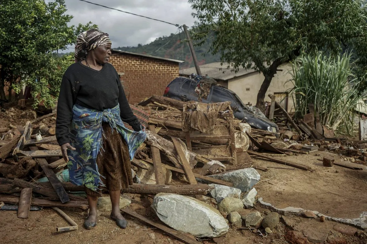 Jessica Mhonderi stands in front of what used to be her son's home in Chimanimani. (KB Mpofu/AP Photo)