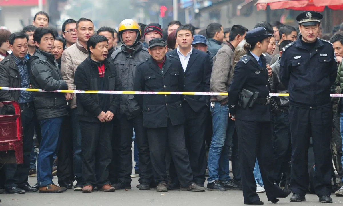 People gather around a crime scene in China. (STR/AFP/Getty Images)