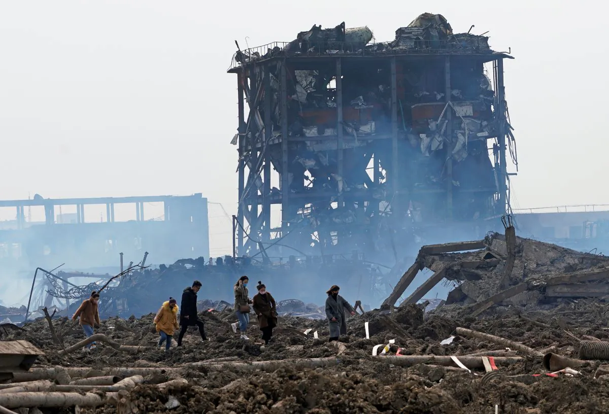 Relatives look for a missing worker at the pesticide plant owned by Tianjiayi Chemical following an explosion, in Xiangshui County, Yancheng, Jiangsu Province, China on March 23, 2019. (Aly Song/Reuters)