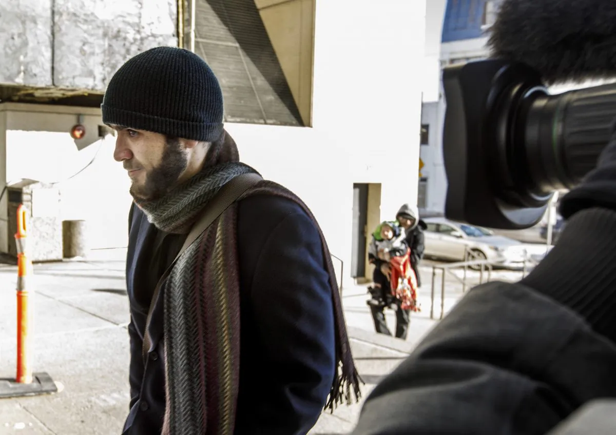 Omar Khadr makes his way into the courthouse in Edmonton on Tuesday Feb. 26, 2019. (The Canadian Press/Jason Franson)