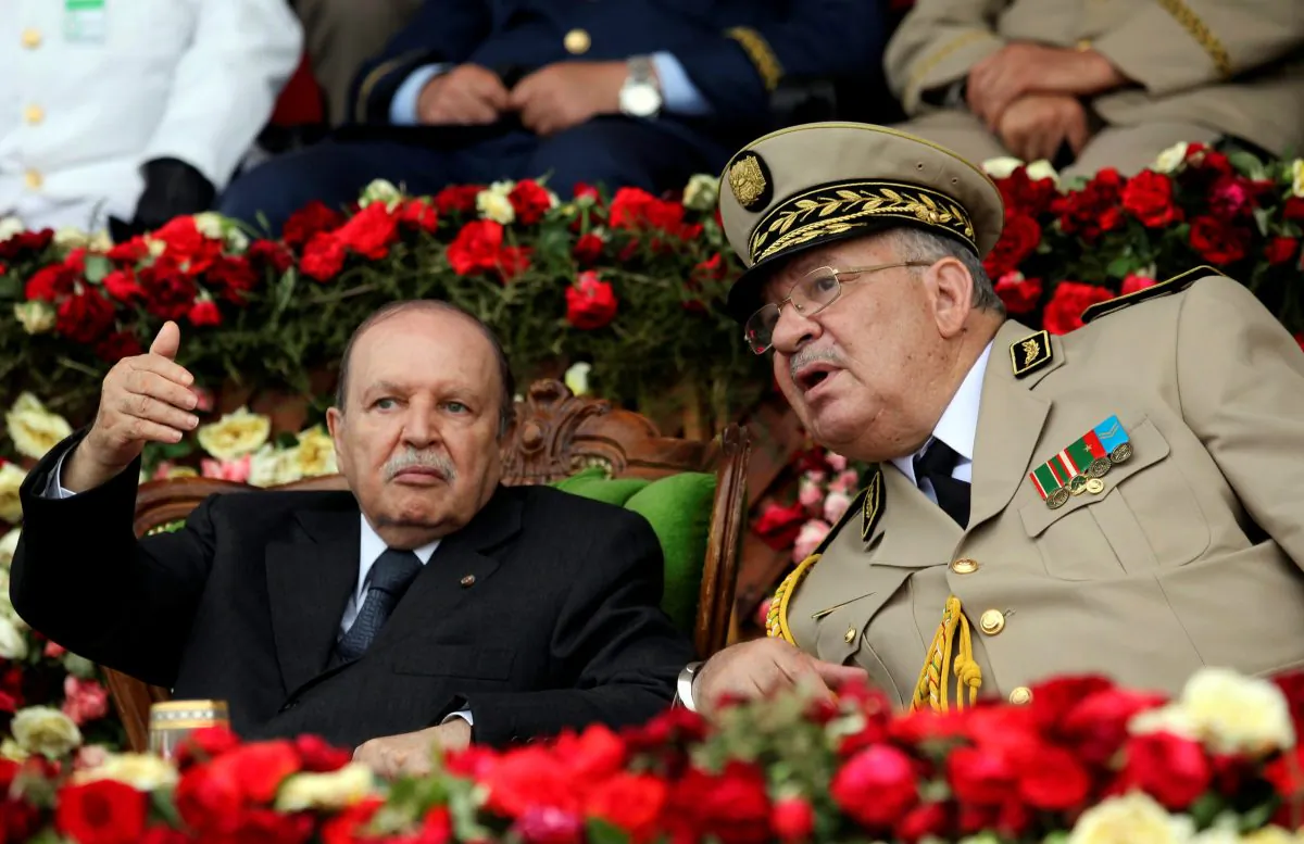 Algeria's President Abdelaziz Bouteflika gestures while talking with Army Chief of Staff General Ahmed Gaed Salah during a graduation ceremony of the 40th class of the trainee army officers at a Military Academy in Cherchell 90 km west of Algiers, Algeria, on June 27, 2012. (Ramzi Boudina/Reuters)