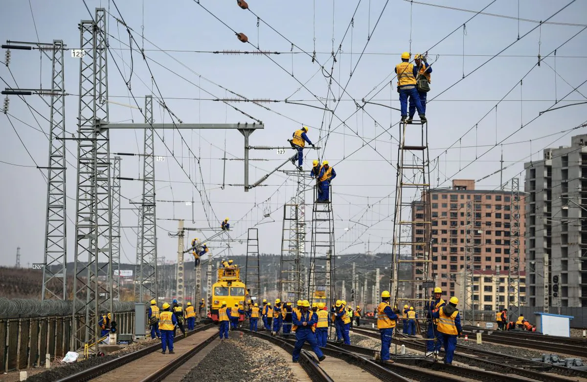 Workers at the construction site of the Tangshan-Hohhot railway in Ulanqab, in north China’s Inner Mongolia region, on March 19, 2019. Job growth bounced back in the first quarter as a broad-based, credit-driven rally took shape. (STR/AFP/Getty Images)