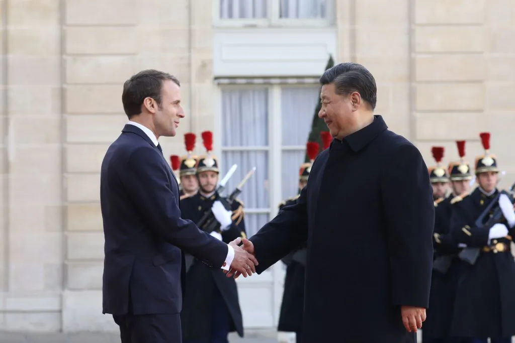 French President Emmanuel Macron (L) welcomes Chinese leader Xi Jinping at the Elysee Palace in Paris, on March 25, 2019, during a state visit. (Ludovic Marin/AFP/Getty Images)