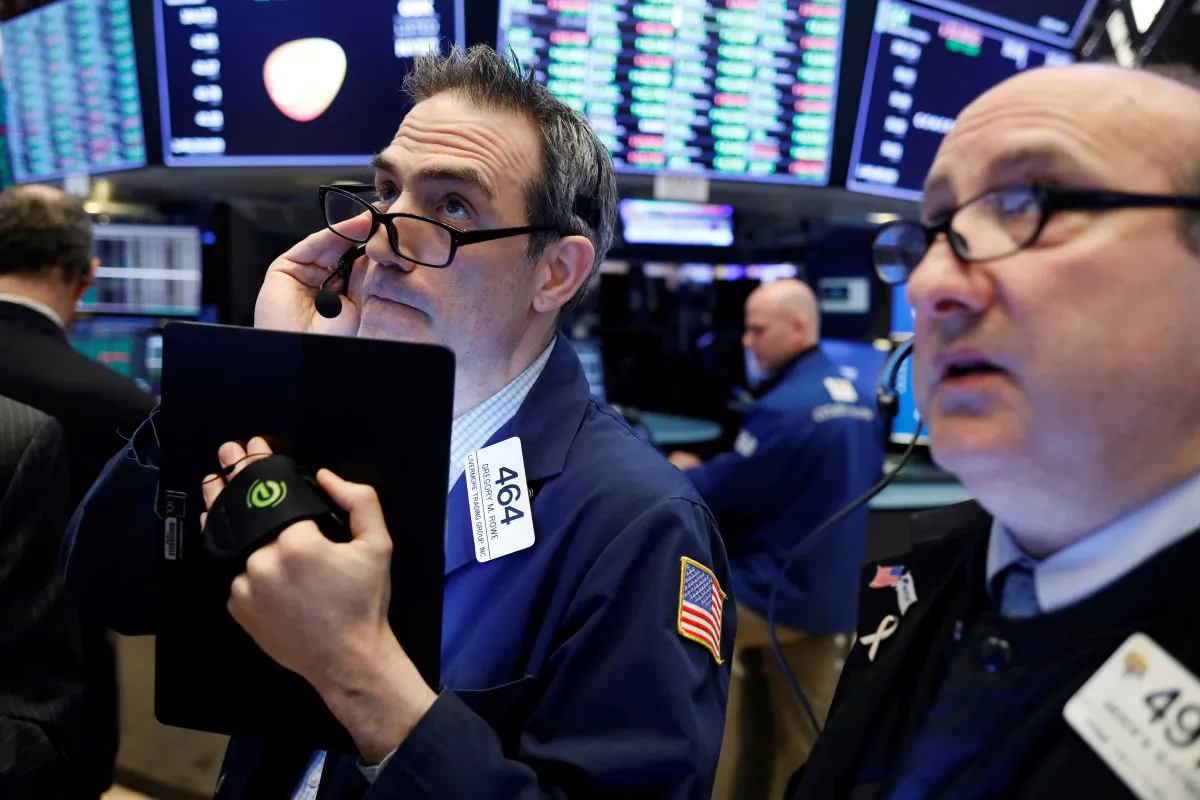 Traders work on the floor of the New York Stock Exchange (NYSE) shortly after the opening bell in New York, U.S., March 26, 2019. REUTERS/Lucas Jackson